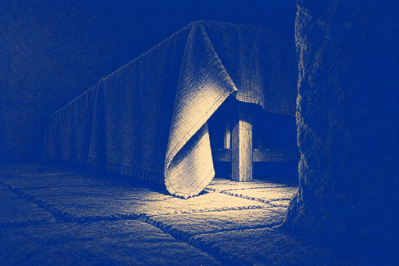 A long banquet table seen end-on with a heavy cloth reaching the floor, one corner of the cloth lifted and folded back to expose the legs of the chairs beneath
